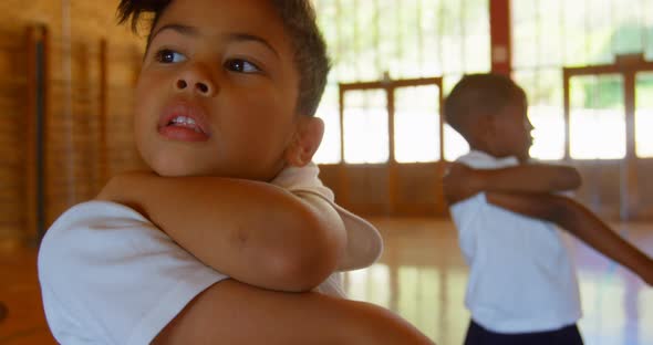 Schoolkids performing yoga in elementary school 4k