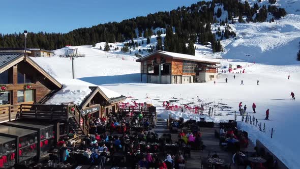 Majestic Winter Aerial Landscape and Ski Resort with Typical Alpine Wooden Houses in French Alps