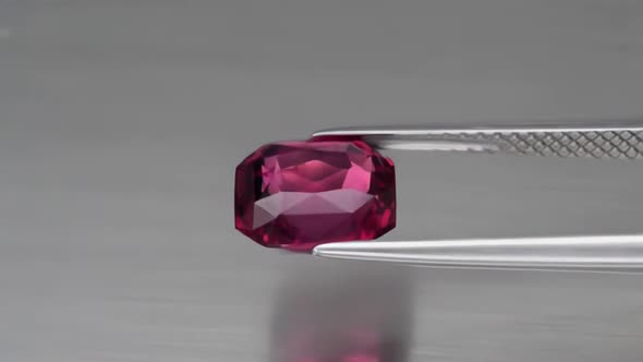 Natural Cherry Rhodolite Garnet on the Background