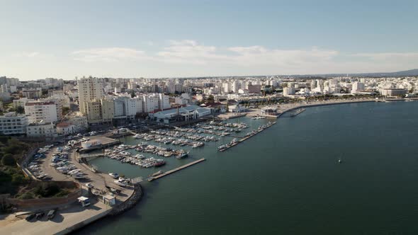 Portimao port against riverside, Portimao cityscape. Algarve vacations concept