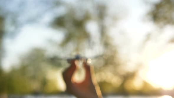 Hand Holds Toy Airplane Model Appearing in Focus and Disappearing, Travel Concept Slow Motion