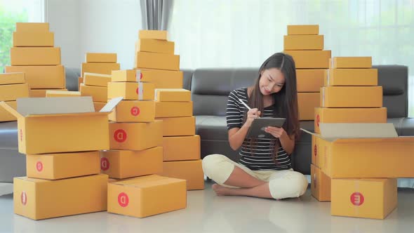 Woman with packing box ready for shipping