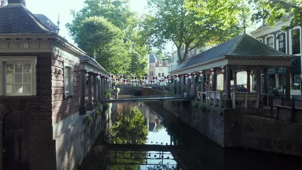 Historic Hoge Gouwe And Lage Gouwe Canal In Centre Of Gouda, Netherlands With View Of Moving Vehicle