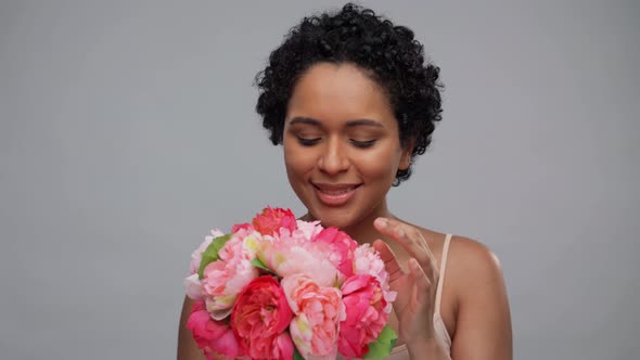 Young African American Woman with Bunch of Flowers