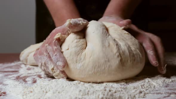 Knead A Large Mass Of Dough On The Table