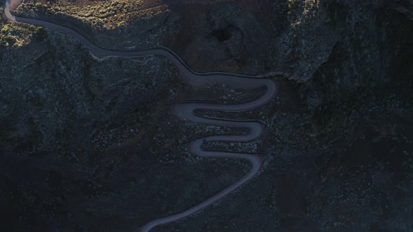 Aerial view of a car driving a serpentine road, Reunion.