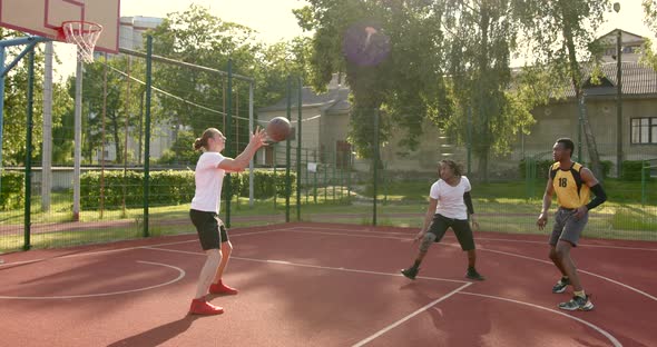 Basketball Players Have a Training Outdoor at Playground