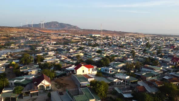 Aerial sunset view of Son Hai Vietnamese remote rural countryside, with 5g tower in the middle fo th