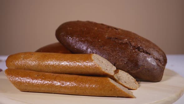 Loafs of fresh baked tasty bread on a rotating plate