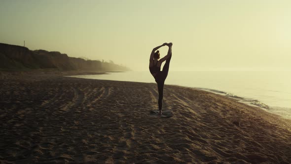 Unknown Girl Standing Twine on Sandy Beach