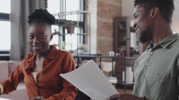 Couple High-fiving after Successful Job