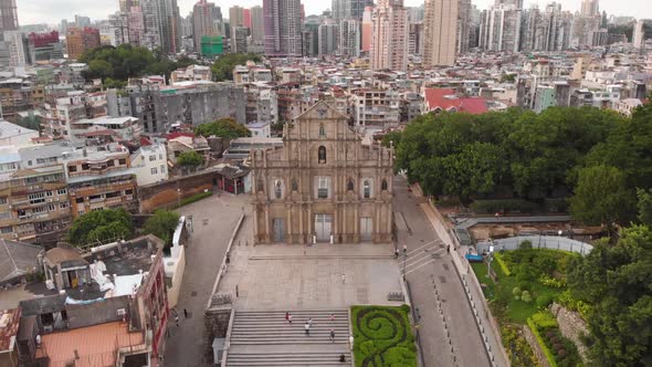 Reversing tilt reveal aerial shot of famous Ruins of Saint Paul's, Macau