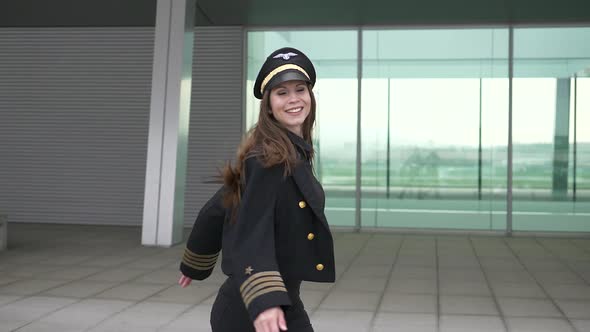 Happiness Lifestyle Portrait of Young Attractive Woman Pilot Dancing