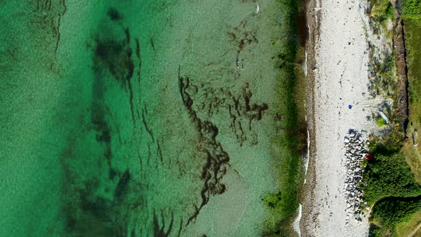 Three Persons Playing Around In The Water At A Beach, Drone Stock Footagex