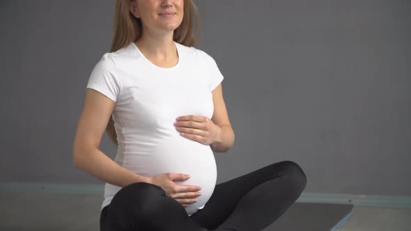 Pregnant Woman in Sportswear Engaged in Yoga. Active Lifestyle of a Pregnant Girl