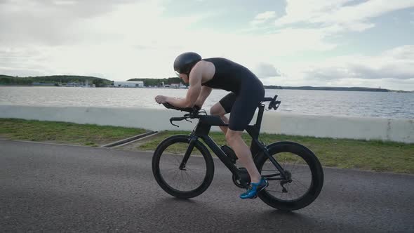 An Hardy Triathlete Rides a Bike Pro Cyclist Rides on the Road Athlete Trains on a Cutting Bike