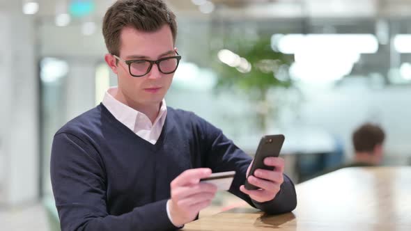 Businessman Making Successful Online Payment on Smartphone