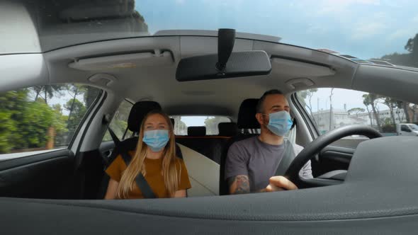 Couple of Friends in Car on Road Trip Holiday