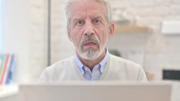 Old Man Gesturing No By Shaking Head