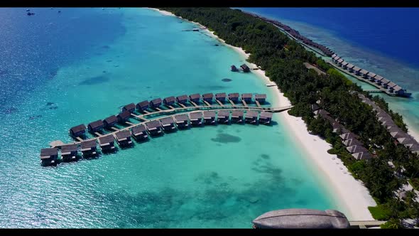Aerial above scenery of beautiful resort beach trip by transparent lagoon and white sandy background