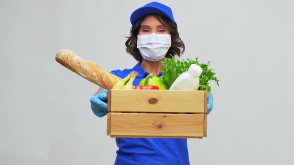 Delivery Woman in Face Mask with Food in Box