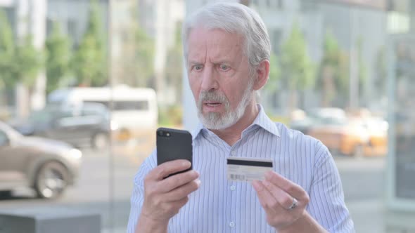 Old Man Upset By Online Shopping Failure on Smartphone Outdoor