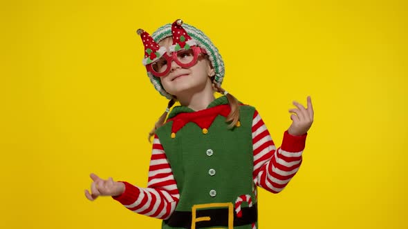 Kid Girl in Christmas Elf Santa Helper Costume Dancing Fooling Around