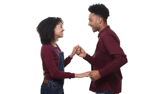 Slow Motion African American Attractivie Young Couple Enjoy Dancing in White Studio Background.