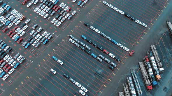 Autos Drive and Park on Warehouse Parking Lot Upper View