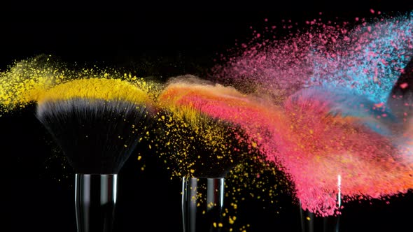 Super Slow Motion Shot of Colorful Powder and Makeup Brushes Touch Each Other at 1000 Fps