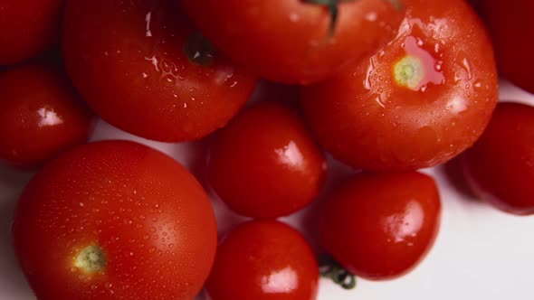 Red Tomatoes with Water Drops in Rotation