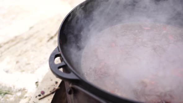 Steam When Cooking Uzbek Pilaf in a Cauldron