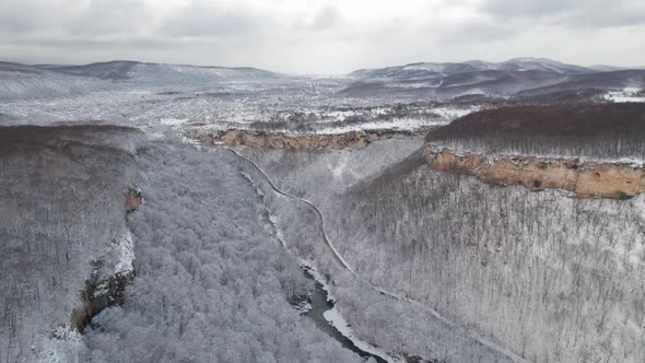 Aerial View of Plateau LagoNaki Mountain Twisted Road in the Winter and Driving Car