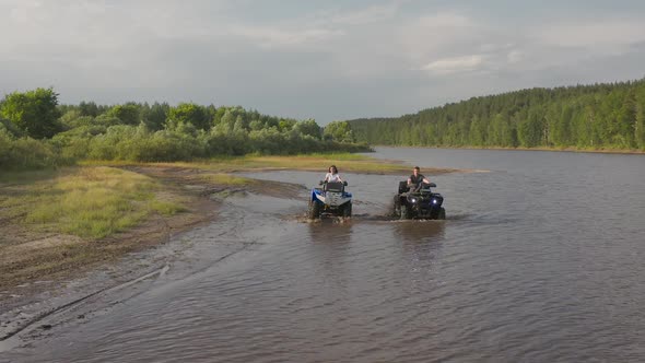 Young Couple on ATVs