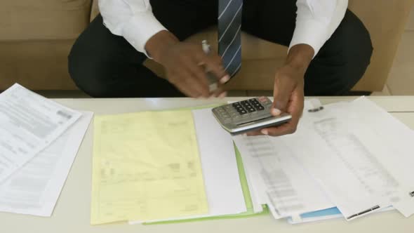 Man calculating the bills at home