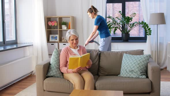 Old Woman Reading Book and Housekeeper at Home