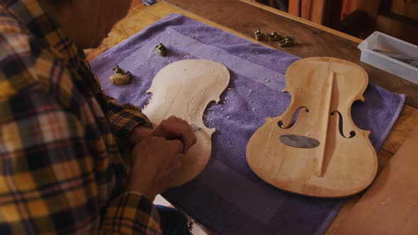 Female luthier at work in her workshop