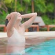 Young asian woman enjoy around outdoor swimming pool for leisure - VideoHive Item for Sale