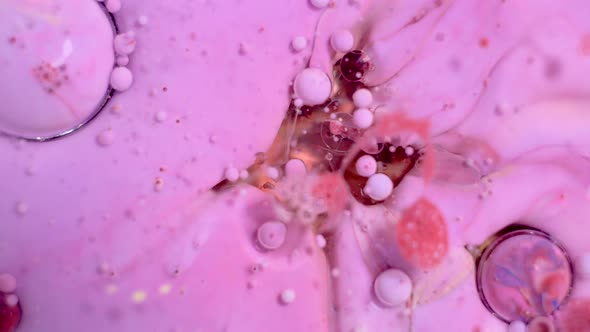 Slow Motion of Bright Colored Bubbles. alt