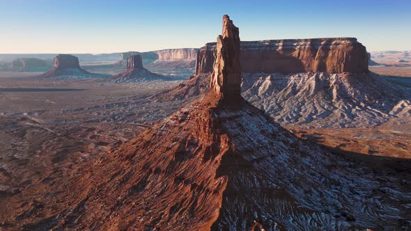 Cinematic Red Desert Landscape with High Rocky Tower of Sandstone Cliff Aerial