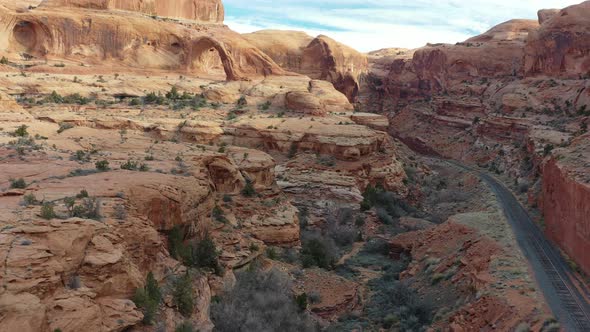 Aerial landscape view of a Scenic road in the red rock canyons during a vibrant sunny day. Taken in