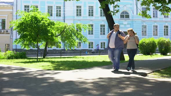 Fat Student Couple Walking in City Park, Urban Date, Leisure Time, Friendship