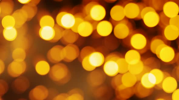 Blurred Golden Christmas Lights Bokeh Background. Party Illumination