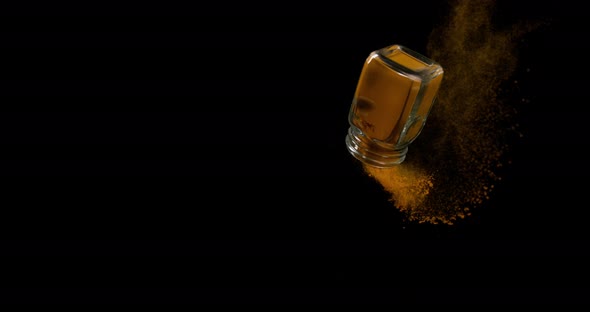 Turmeric, curcuma longa, Powder falling against Black Background, Indian Spice, Slow Motion 4K