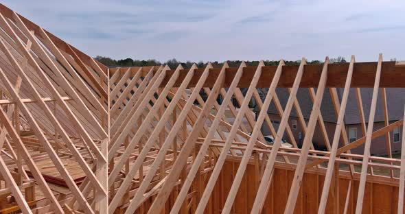 Wooden Roof Truss on a Clear Sky Background