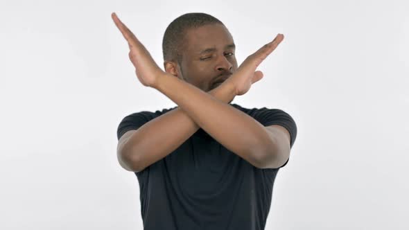 Disapproving Young African Man Rejecting By Arm Gesture on White Background