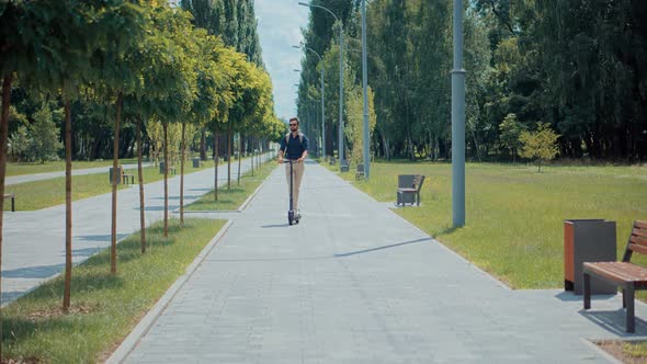 Renewable Energy Transport. Alternative Transportation In City. Man Taking Electronic Scooter Share.