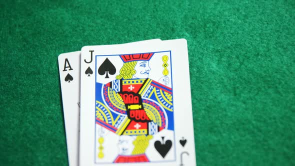 Two playing cards on poker table in casino 4k