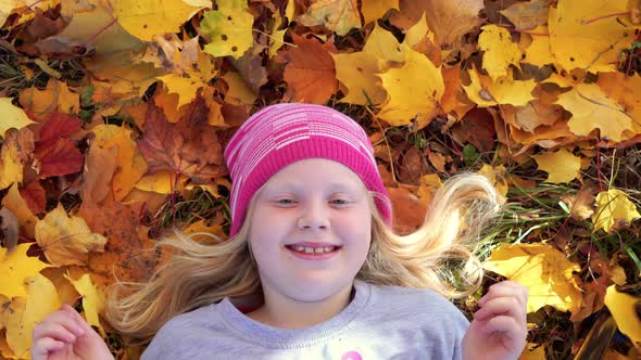 Portrait of a Beautiful Girl in the Autumn Park