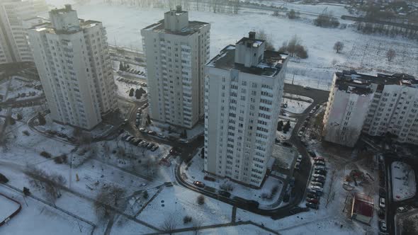 Flight over the city block. Modern multi-storey buildings.